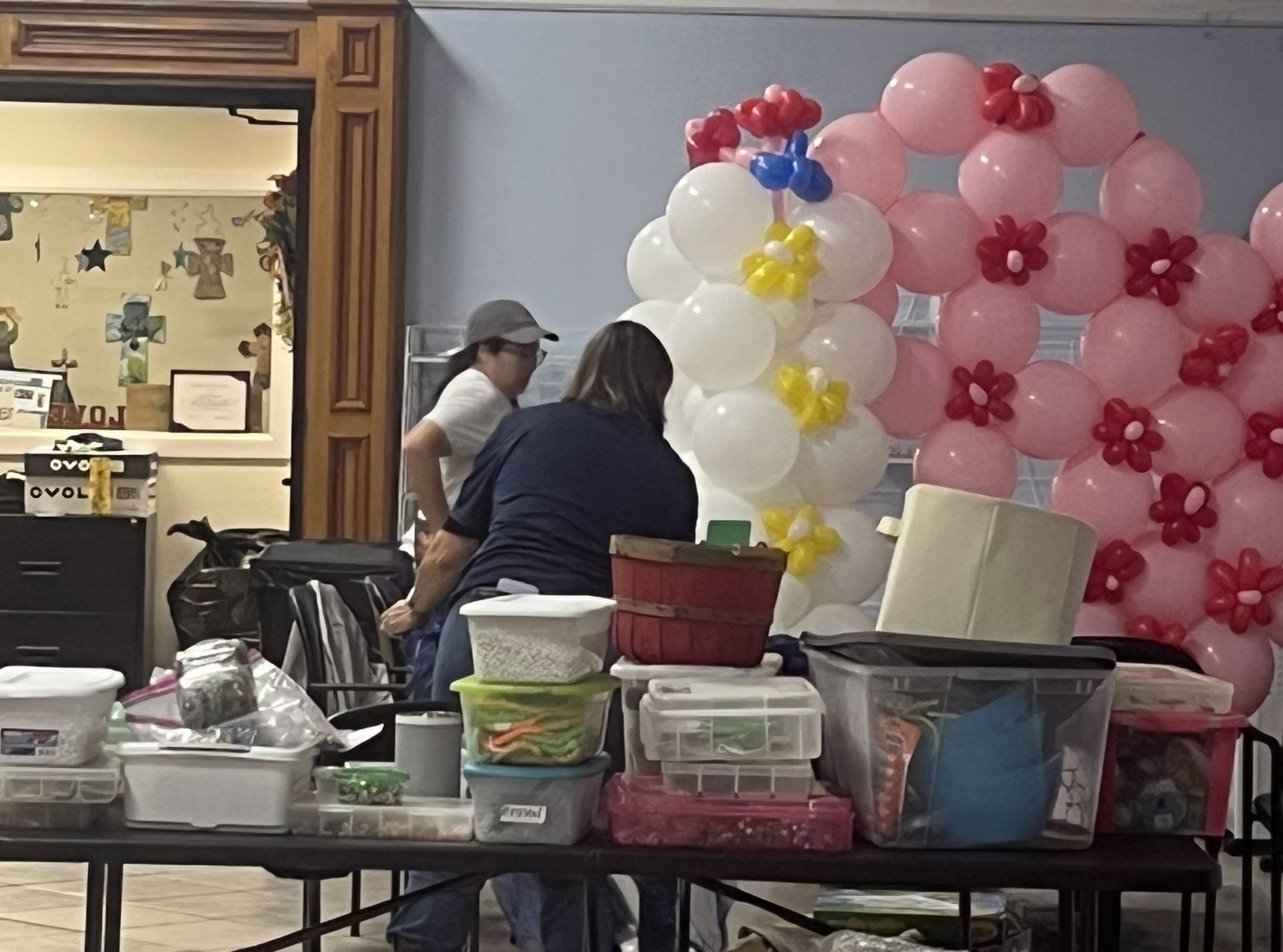 A table with a bunch of balloons on it