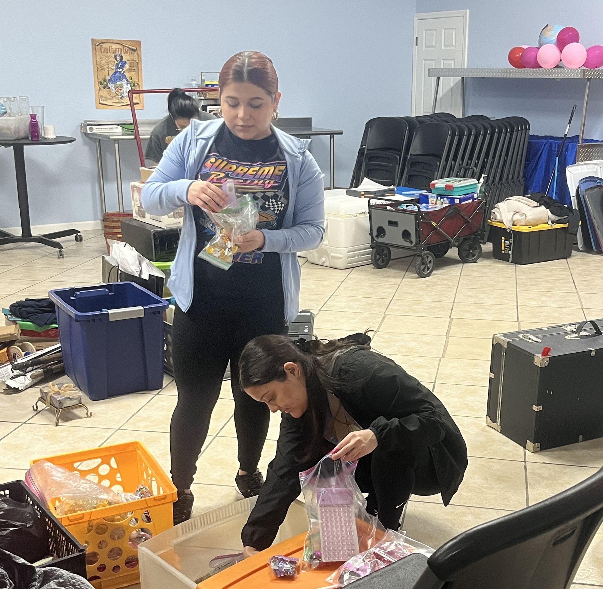 A woman wearing a t-shirt that says ' miraculous ' on it