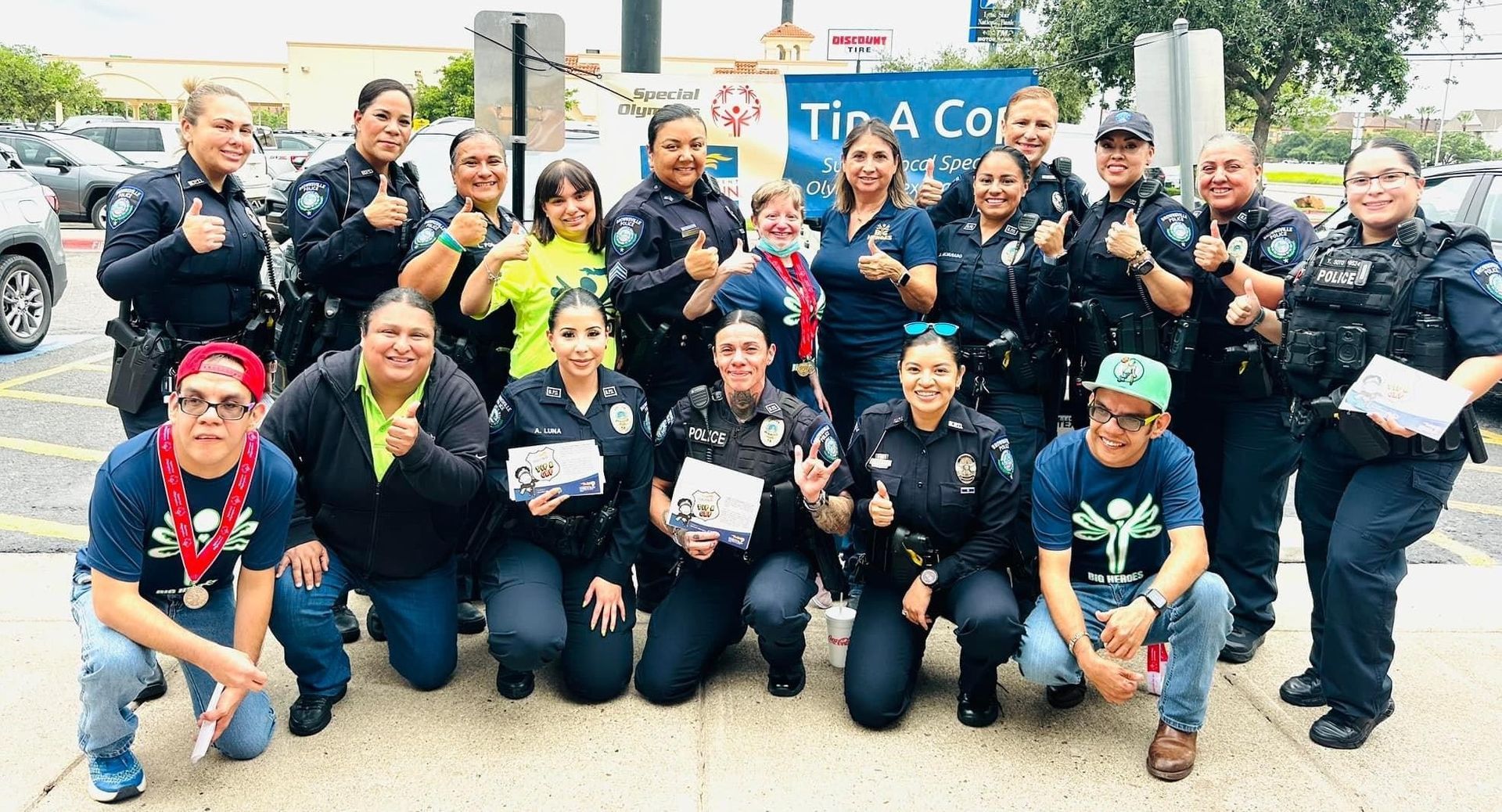 A group of police officers are posing for a picture.