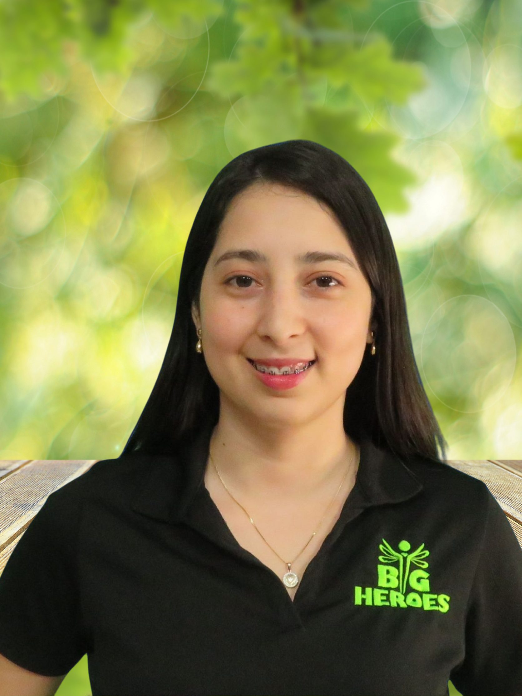 A woman wearing a black shirt that says big heroes