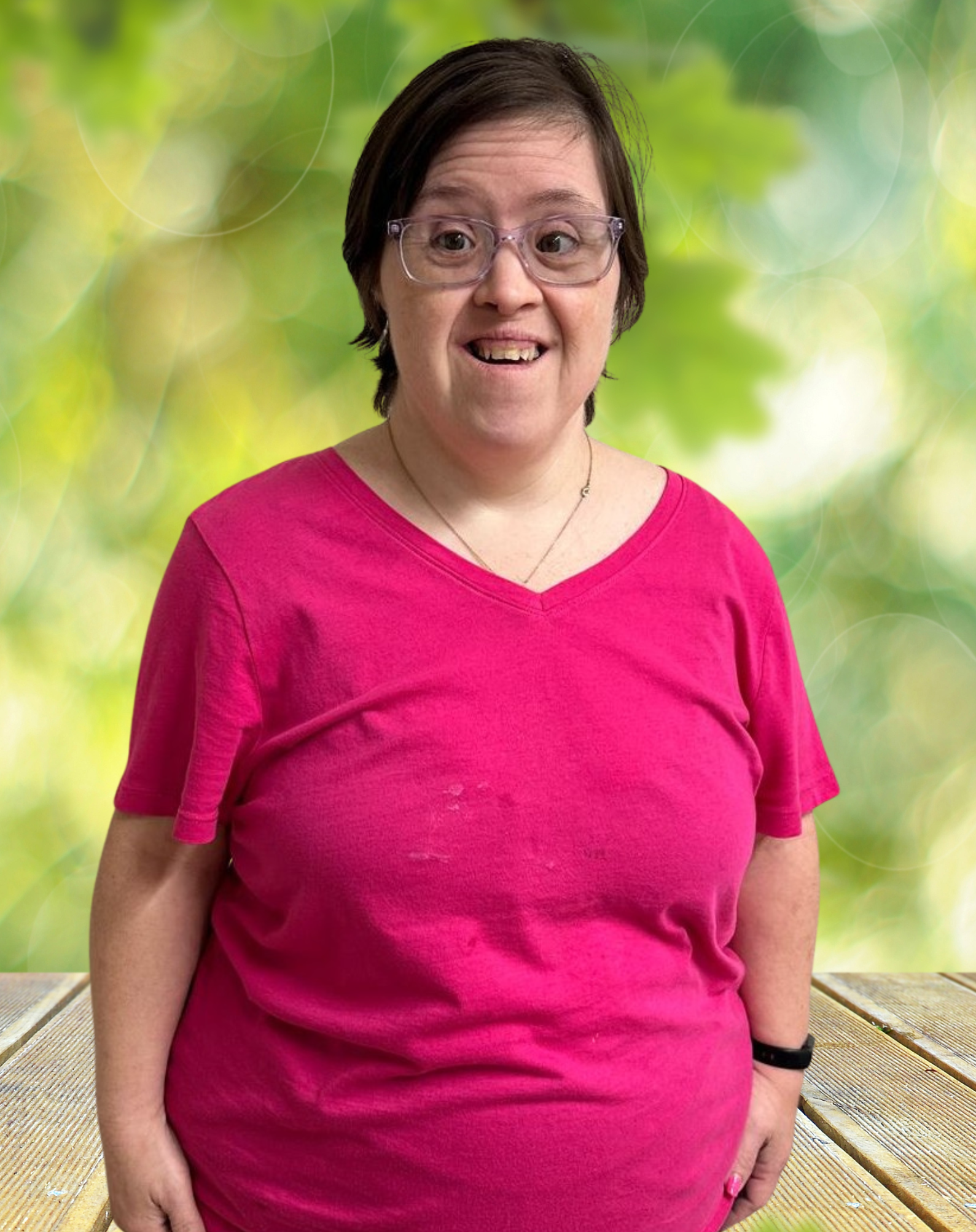 A woman with down syndrome is wearing glasses and a black shirt.