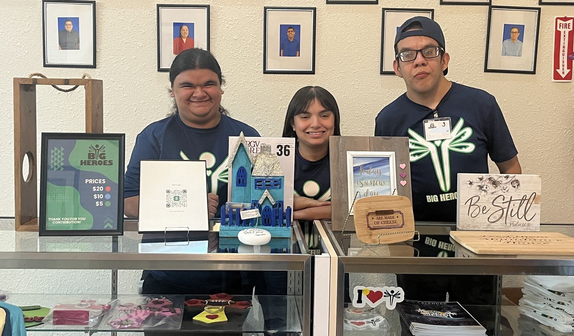 A group of people are sitting at a table in a store.