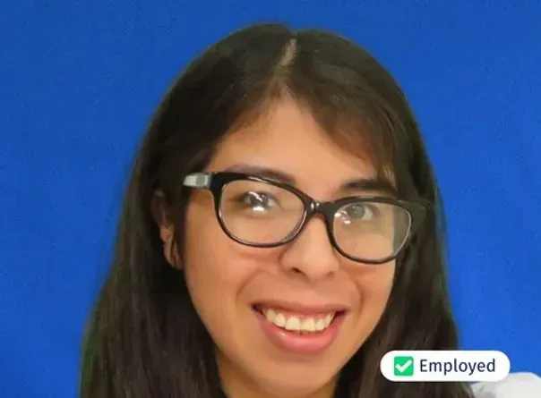 A woman wearing glasses is smiling and has the word employed next to her