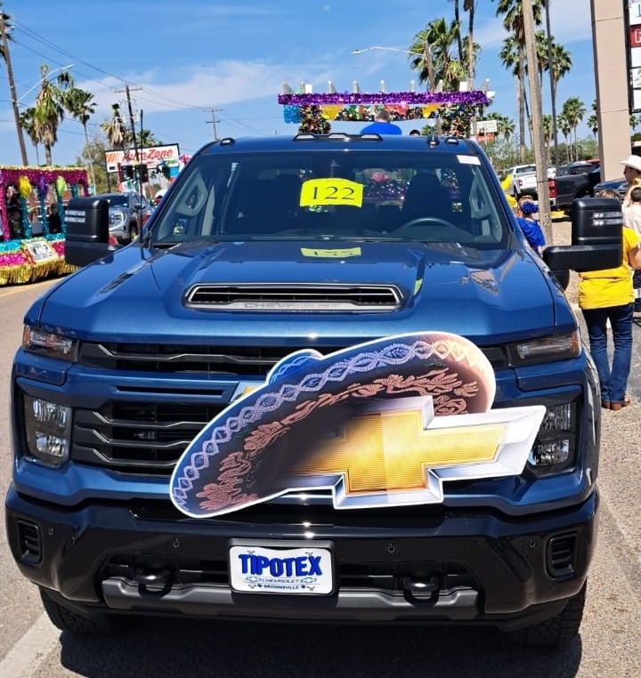 A blue chevrolet truck with a sombrero on the front
