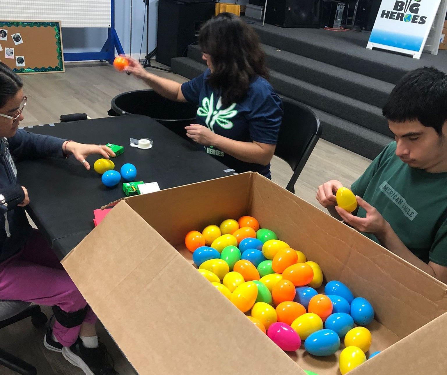 A group of people are playing with balls in a room.