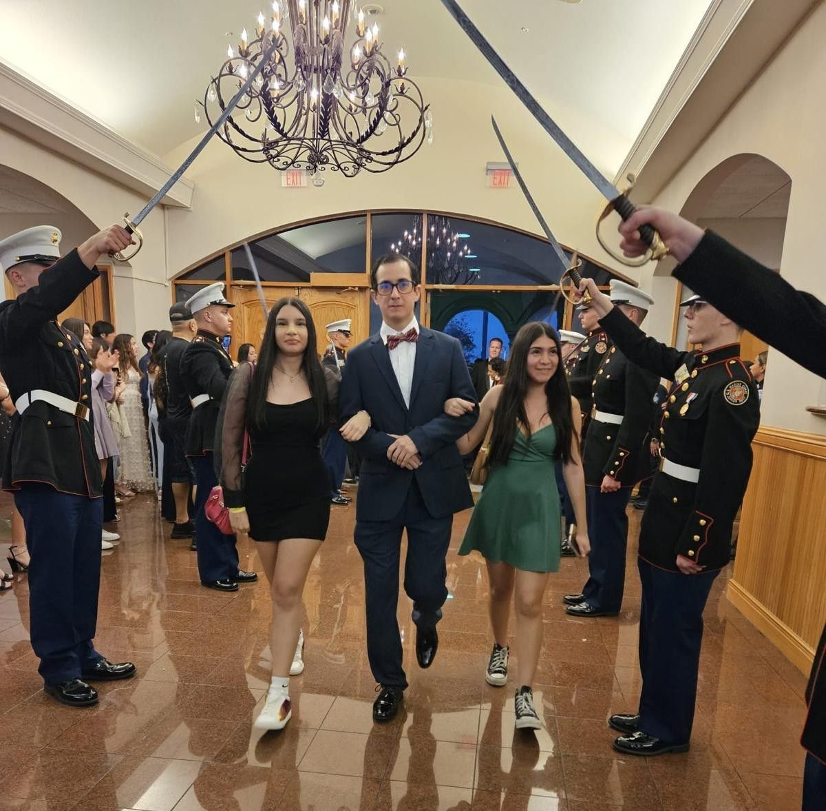 A group of people holding swords in a room