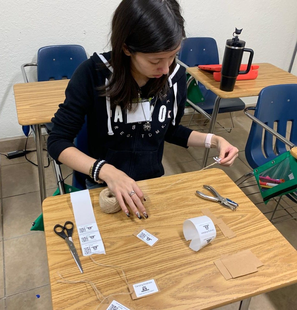 A group of people are standing around a ribbon cutting ceremony.