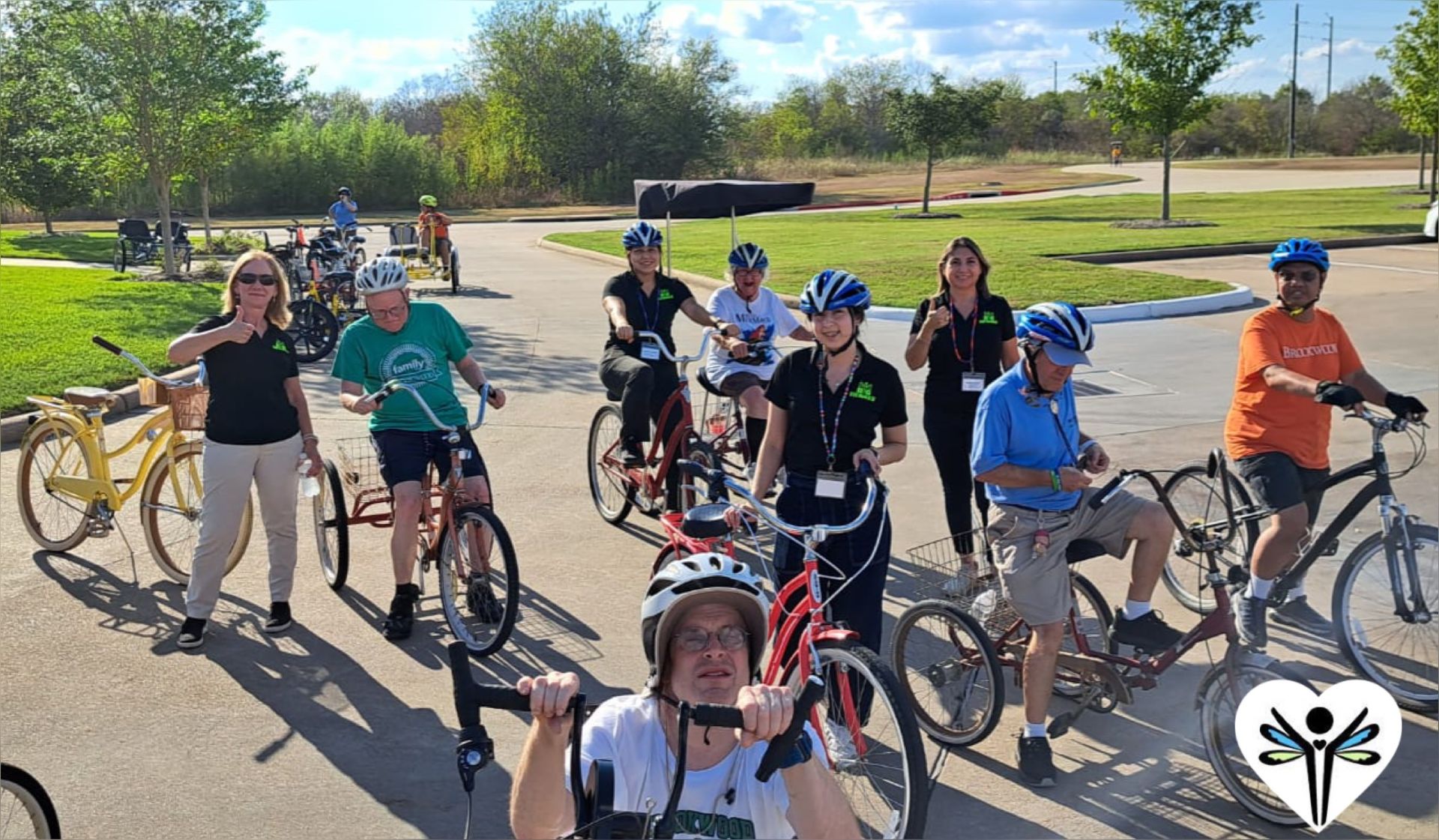 A group of people are riding bicycles in a park.