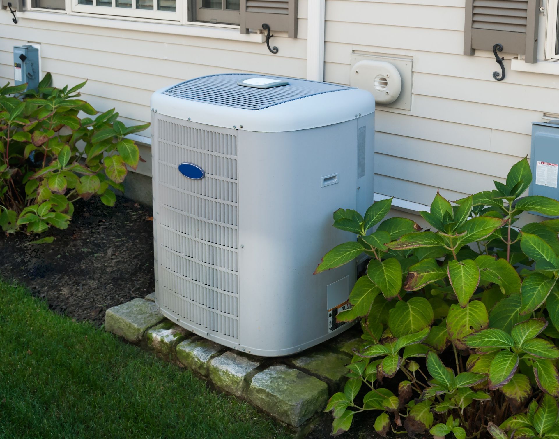 An outdoor residential heating and air conditioning unit