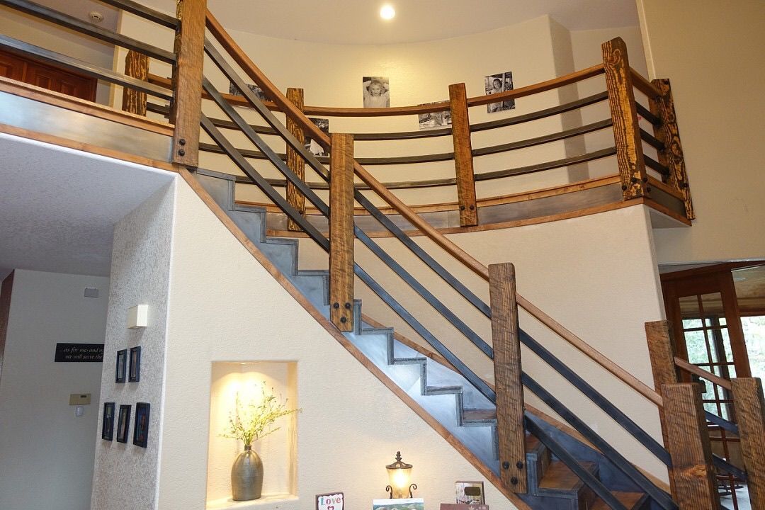 A staircase with a wooden railing in a house