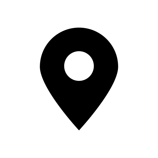 A black map pin with a circle in the middle on a white background.