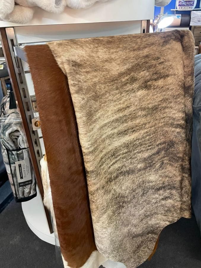 A Piece of Fur is Hanging on a Rack in a Store — P.A.M. Furnishings Pty Ltd In Yeppoon, QLD