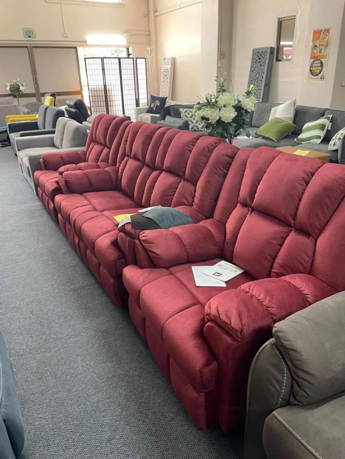A Row of Red Reclining Couches in a Living Room — P.A.M. Furnishings Pty Ltd In Yeppoon, QLD