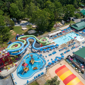 An aerial view of a water park with a large water slide