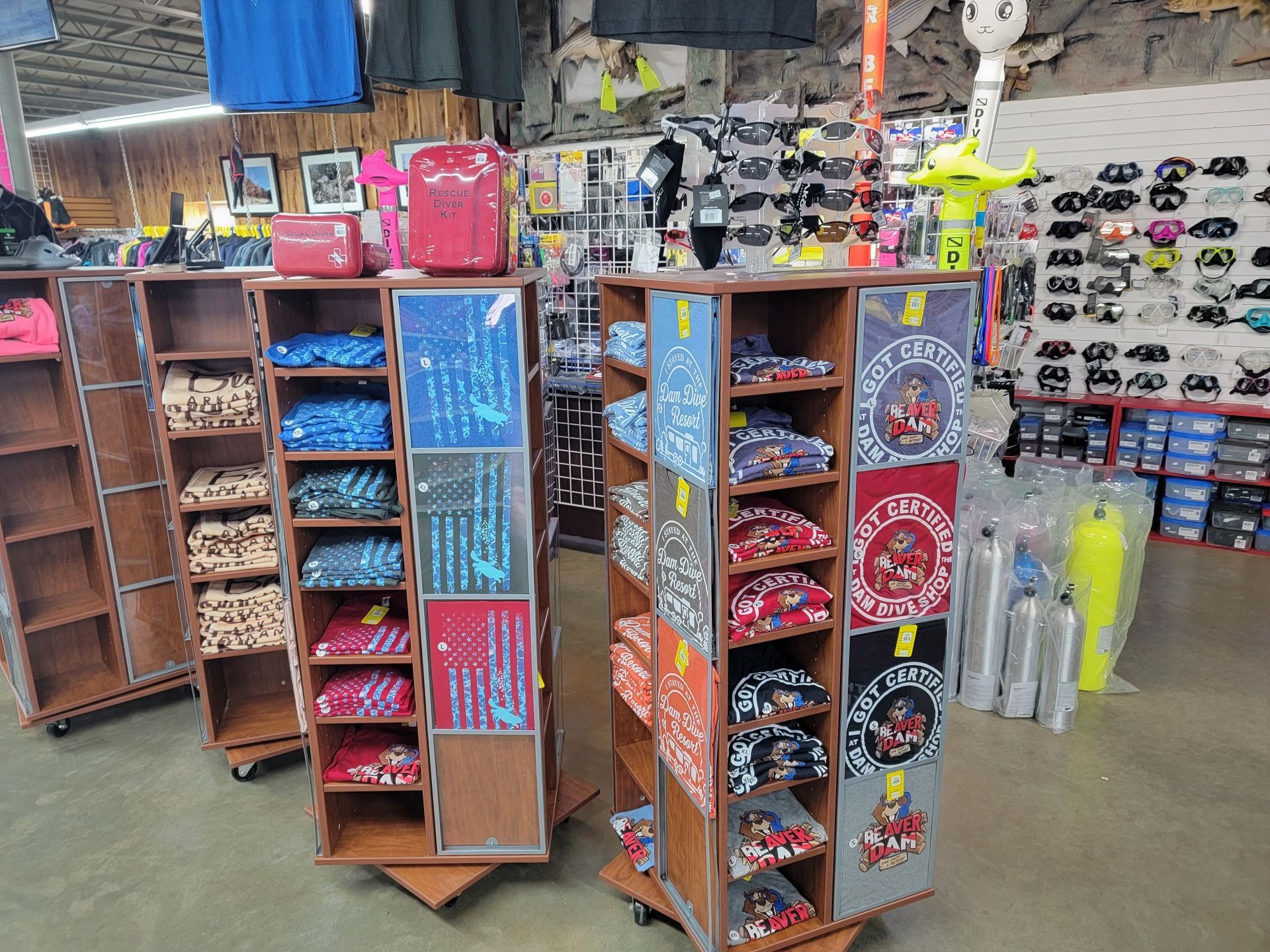 A store filled with lots of t-shirts and other items.