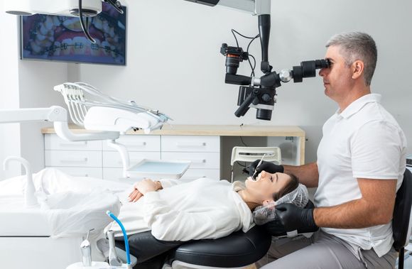 a dentist checking up a woman