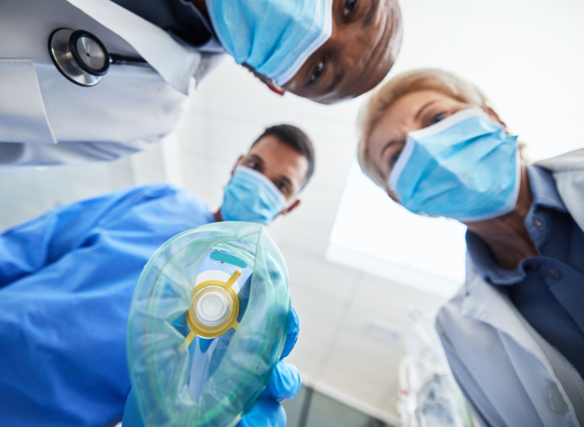 a group of doctors standing around each other