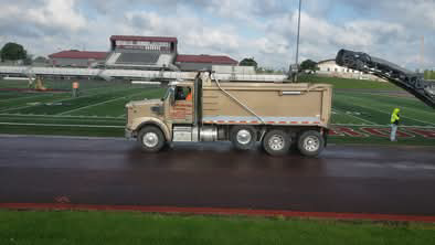 Dump truck on a wet track.