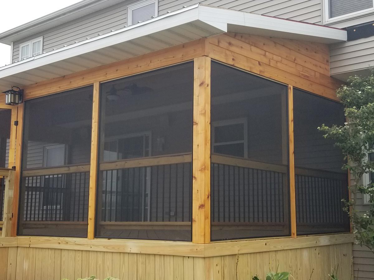 A screened in porch on the side of a house located in Covington, IN.
