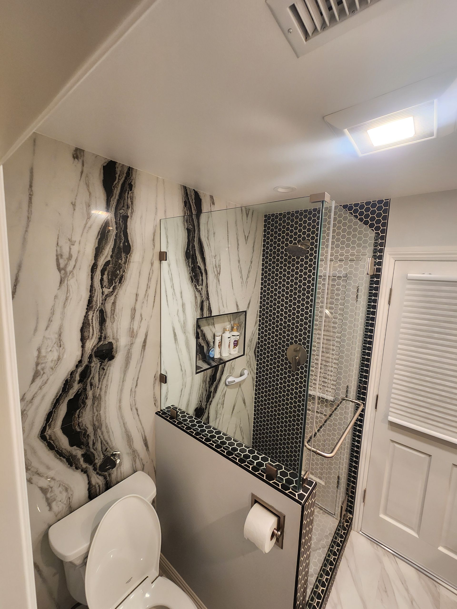 A large bathtub with a faucet in a bathroom located in Danville, IL.