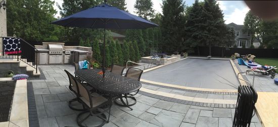 Brick Paving Pool Deck with Grill in Background