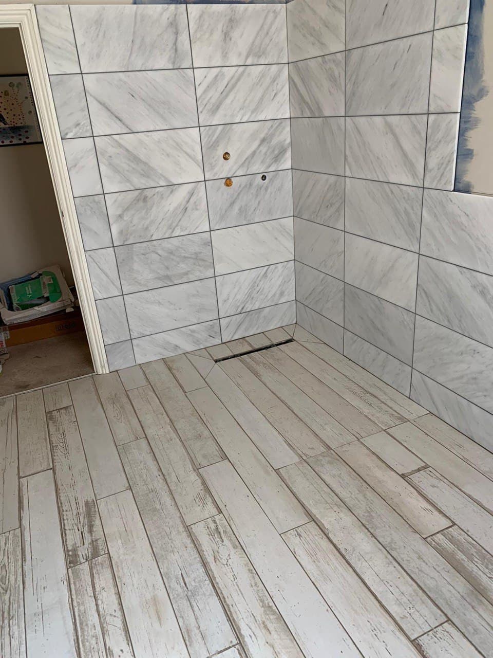 Photo of a Shower and Floor Tiling installation.  This photo was taken in Brighton and Hove East Sussex UK