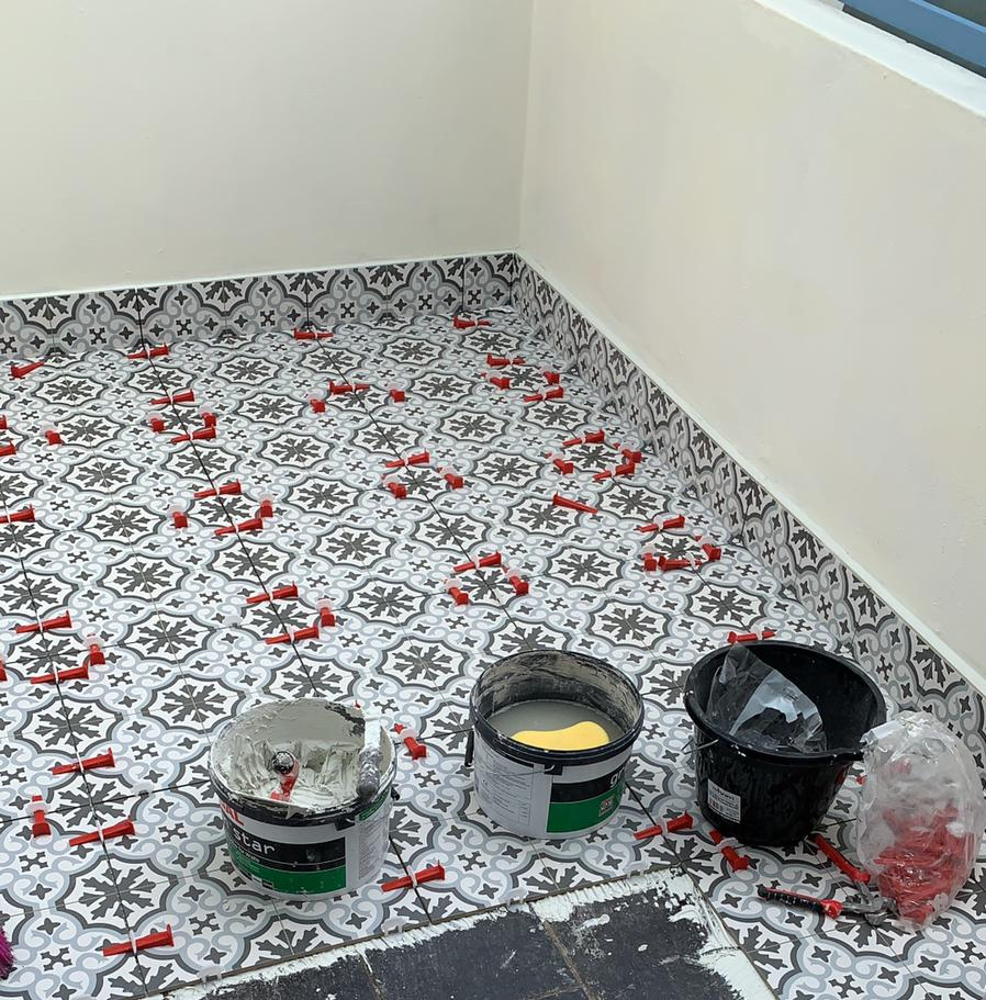 This is a photo of a floor tiling project in progress in Brighton & Hove