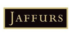 Logo for Jaffurs, a fur retailer; black rectangle with gold frame, gold text.