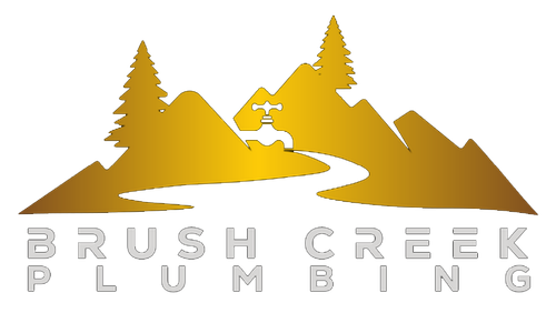 A logo for brush creek plumbing with a mountain and trees