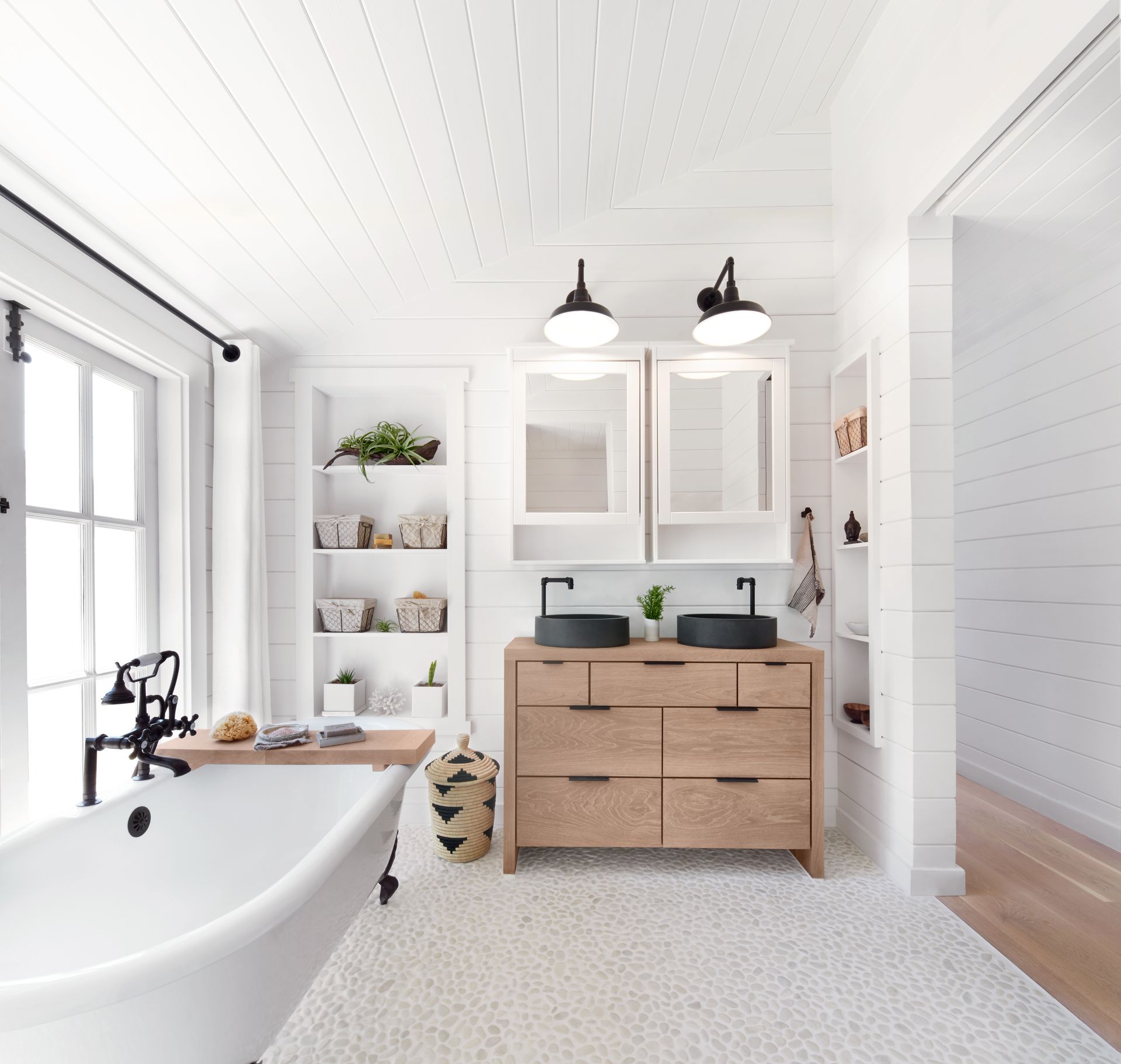 Rustic modern farmhouse bathroom in a small cottage after bathroom renovation. Rustic modern farmhouse bathroom in a small cottage after bathroom renovation.
