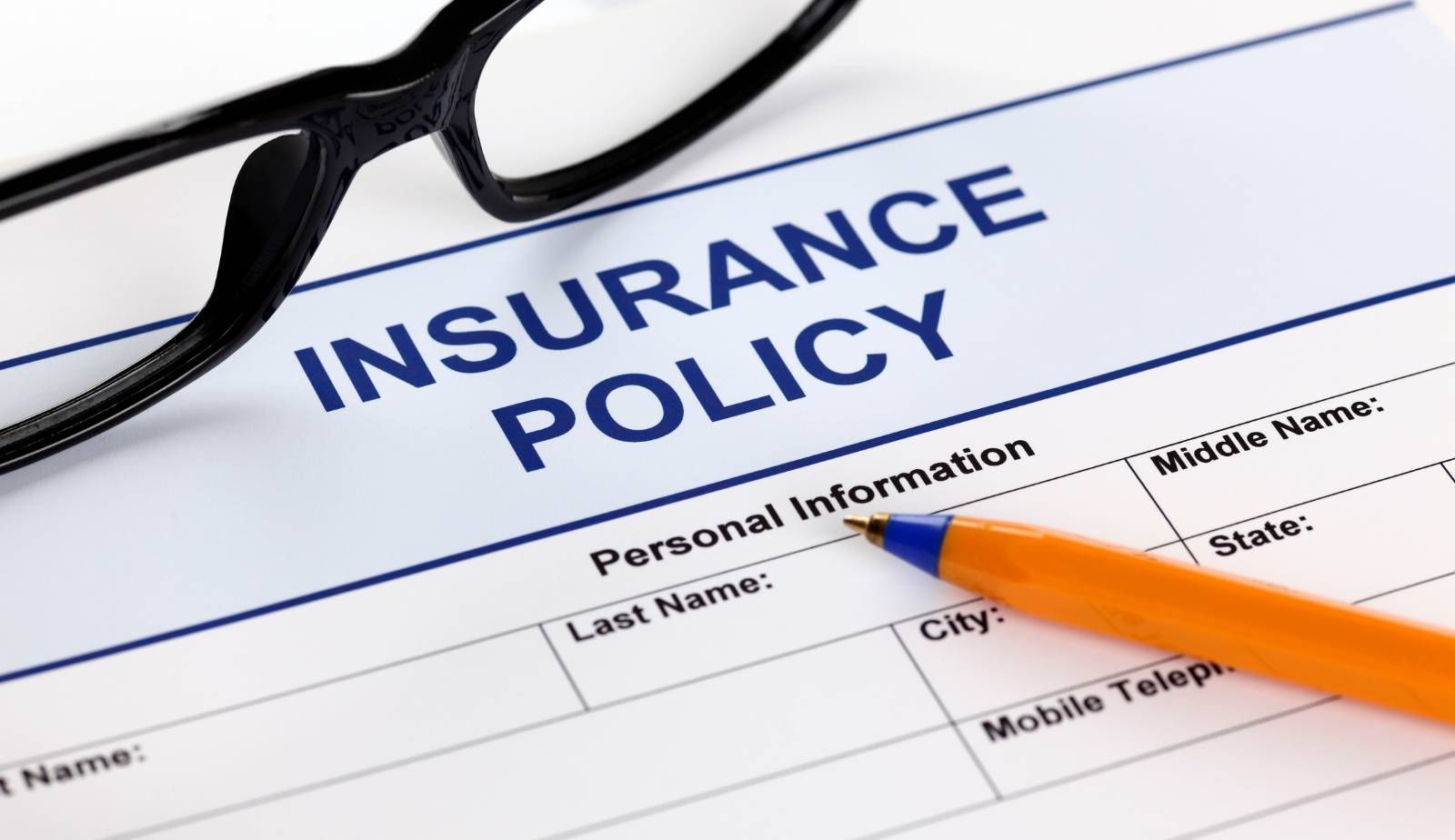 A Louisiana homeowner reading through their homeowners insurance policy, looking for specific water