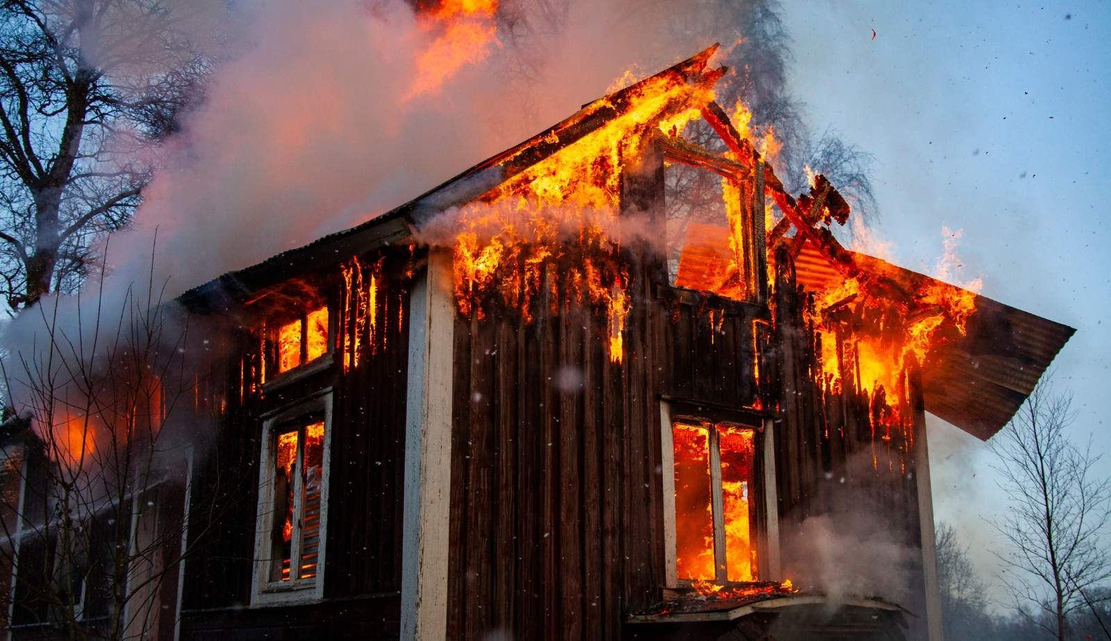 A Louisiana family receiving support from a counselor after experiencing fire damage in their home, 