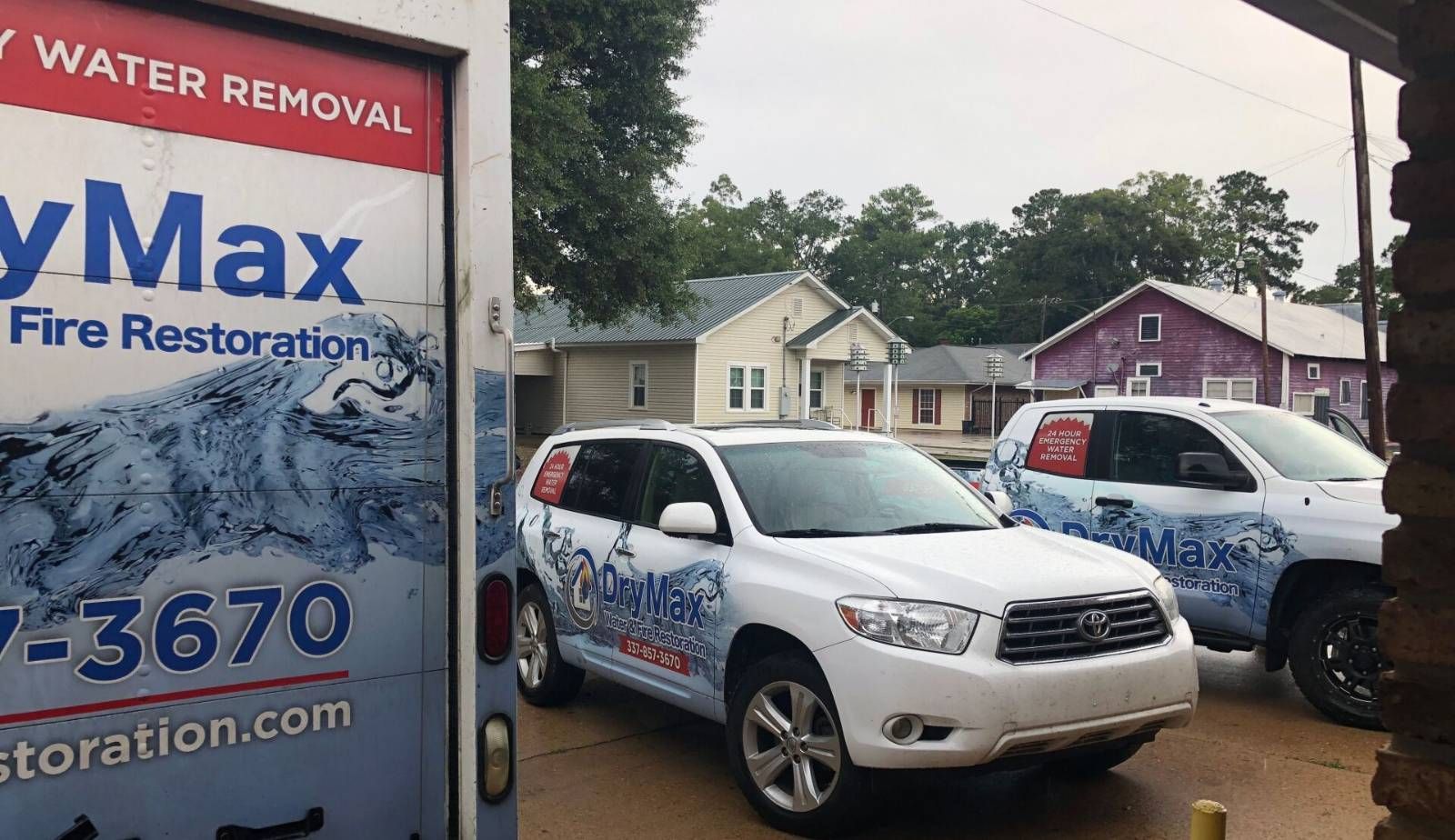 A Drymax technician inspecting the walls and crawl space of a historic Louisiana home for signs of hidden water damage and leaks.