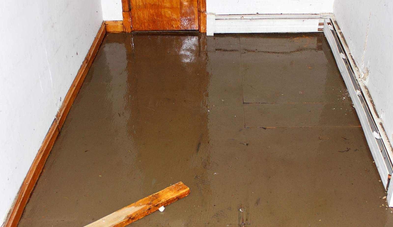Cupped baseboards and bulging drywall—common signs of a hidden leak in Louisiana homes.
