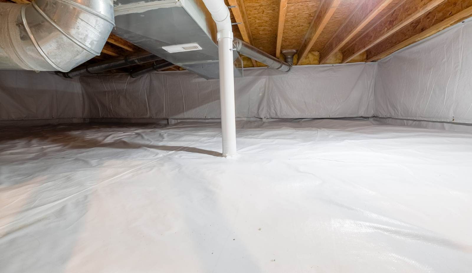 Low-grain dehumidifiers and air movers drying joists and subfloor in a Baton Rouge crawl space.