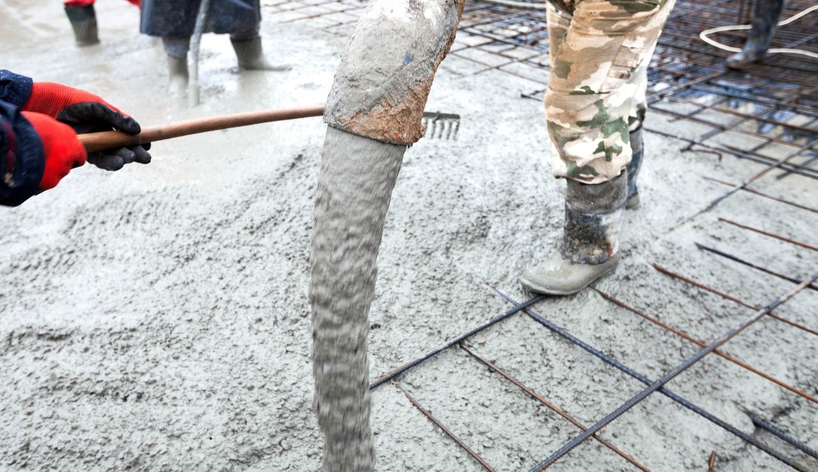 A Louisiana slab home with visible signs of moisture around the base.