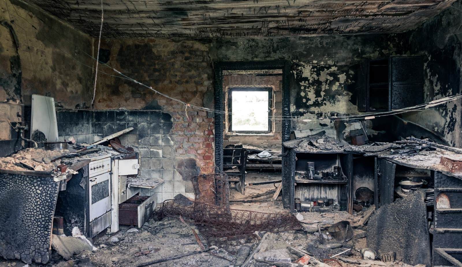 Drymax technicians removing soot and char from a fire-damaged kitchen in Baton Rouge, LA.
