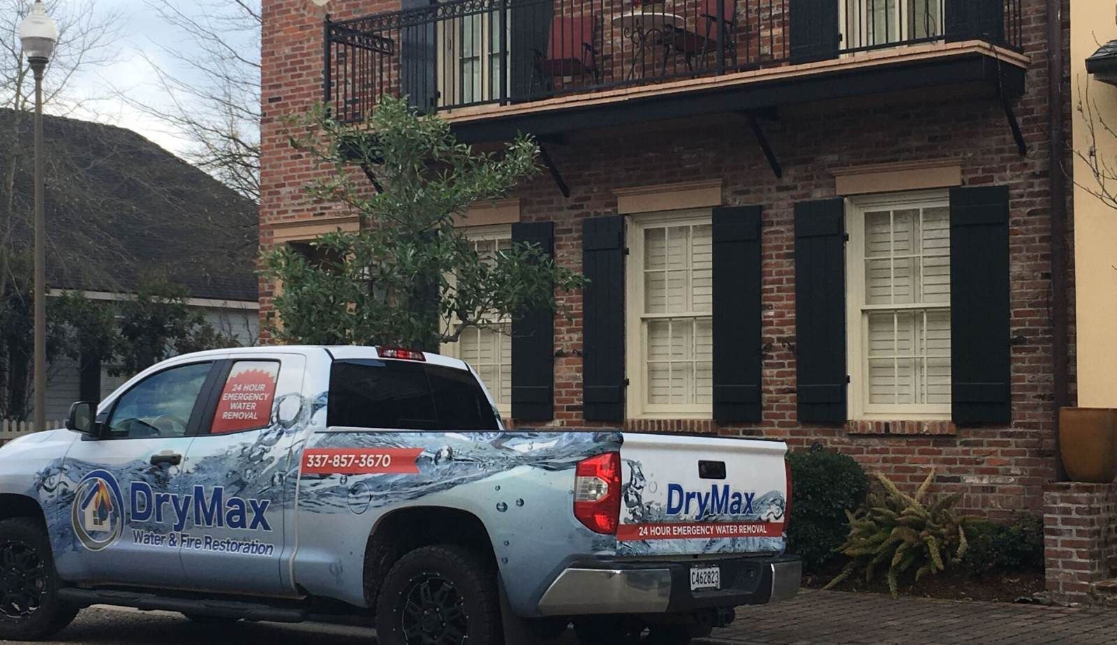 After-hours board-up and roof tarping by Drymax in Baton Rouge, LA to secure a fire-damaged home.
