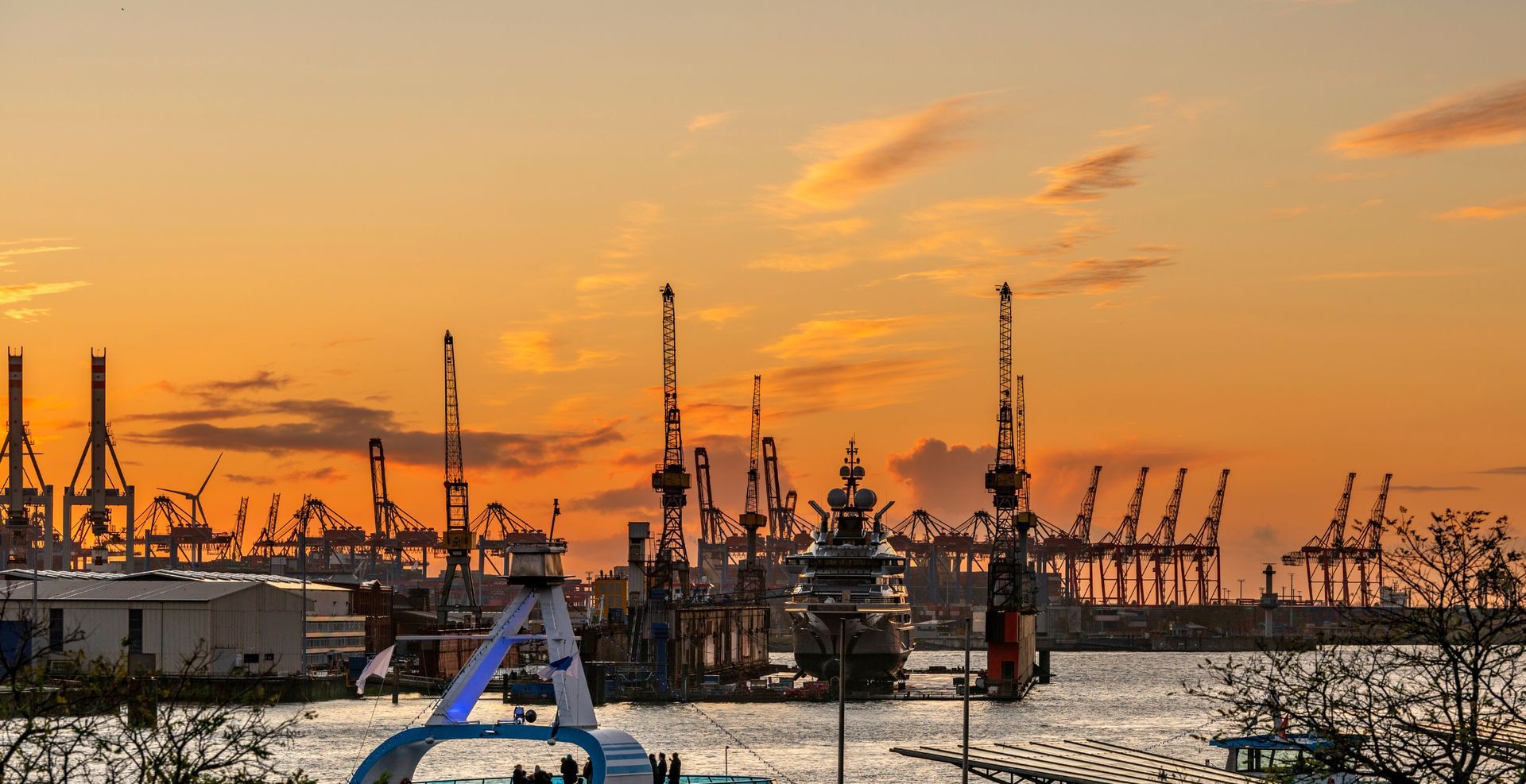 newly built Superyacht in floating lift at Hamburg docks