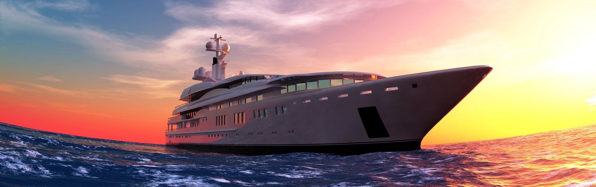 Superyacht in calm sea with beautiful sunset in background