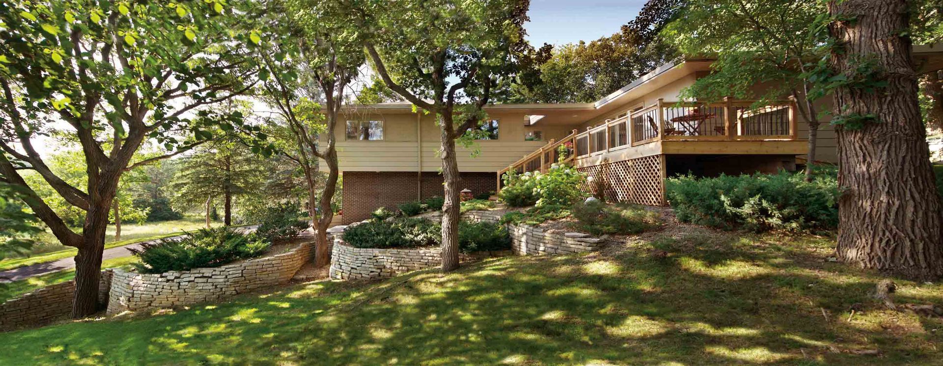 A Large House with A Large Deck Is Surrounded by Trees and Grass | Cranbourne, VIC | Cranbourne Fencing Pty Ltd