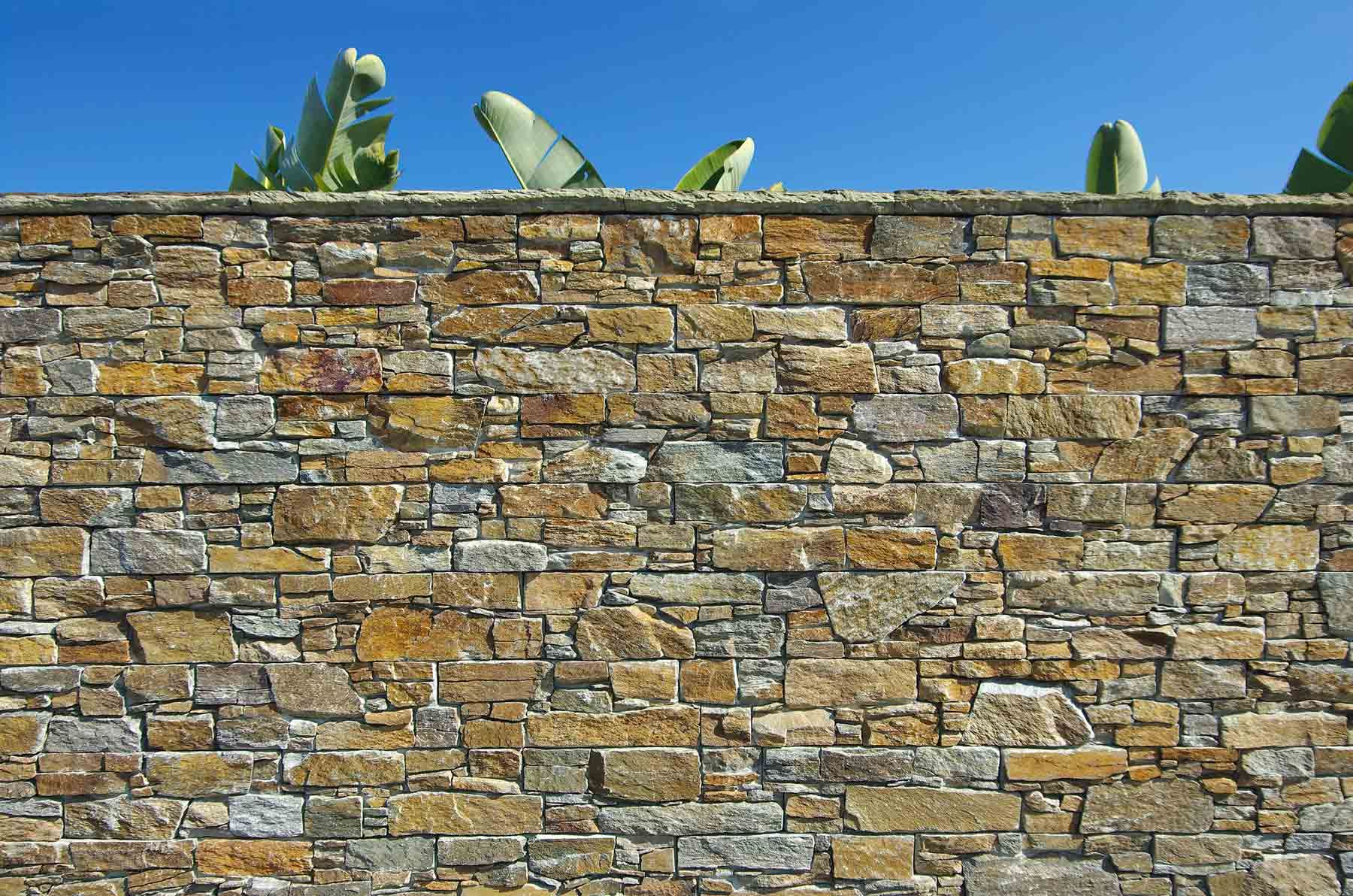 A Stone Wall with A Blue Sky in The Background | Cranbourne, VIC | Cranbourne Fencing Pty Ltd