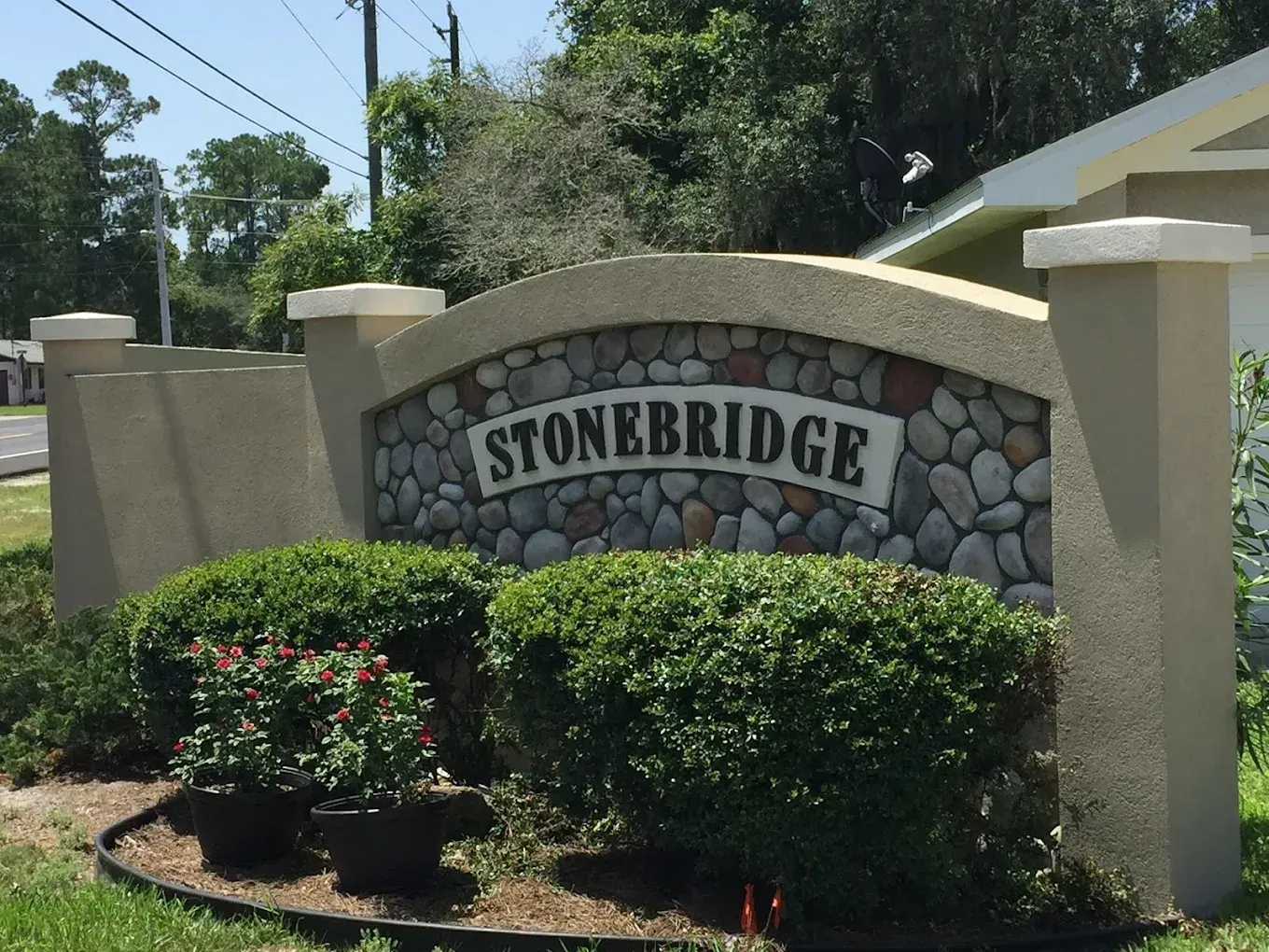 A living room with a chaise lounge and a sliding glass door