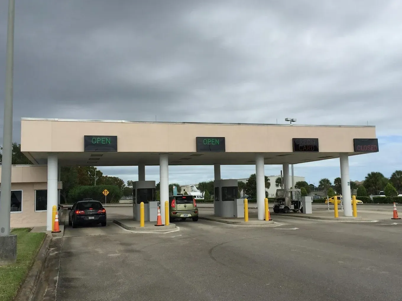 A toll booth with a sign that says open