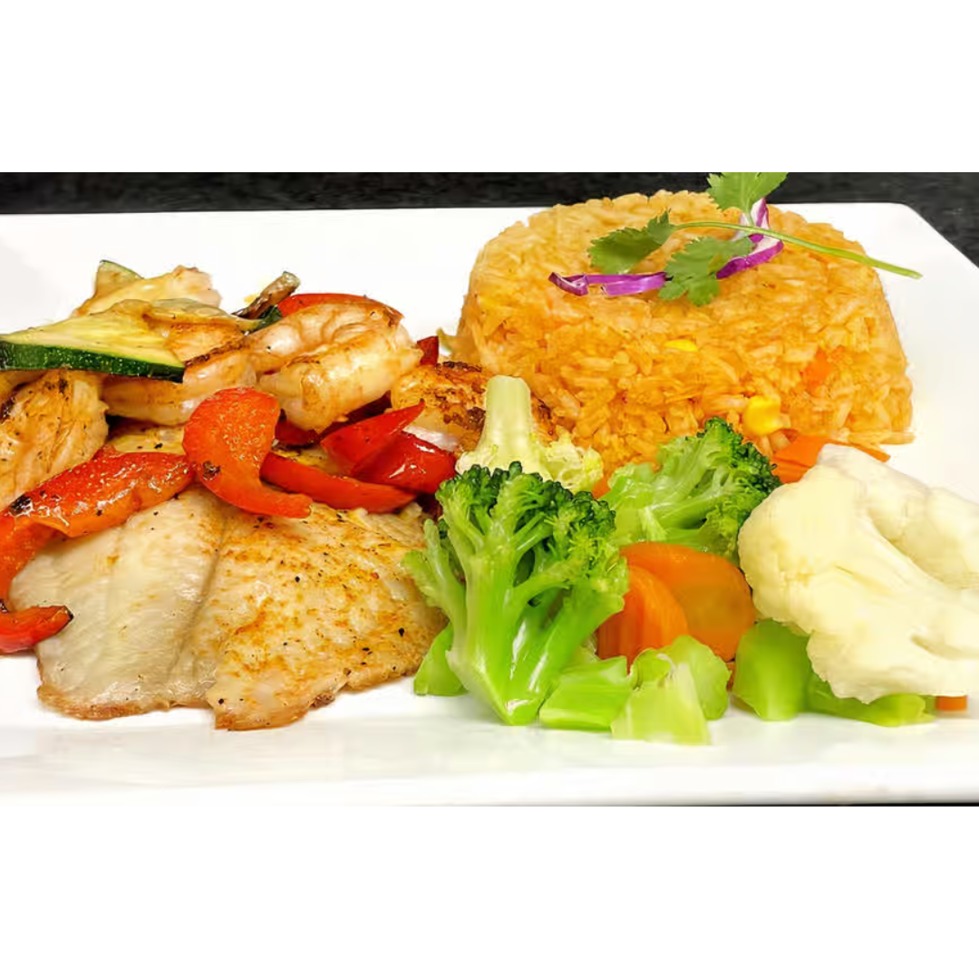 A white plate topped with rice , vegetables , and fish.