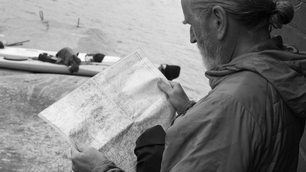 Erik checking the  map during a kayak trip in Gryt Archipelago, Sweden