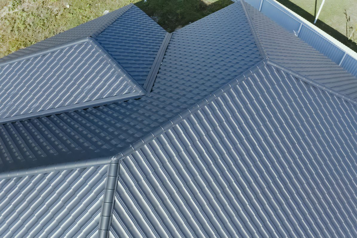 An Aerial View of a Gray Roof With a Fence in the Background — Stormguard Roofing In Burpengary, QLD
