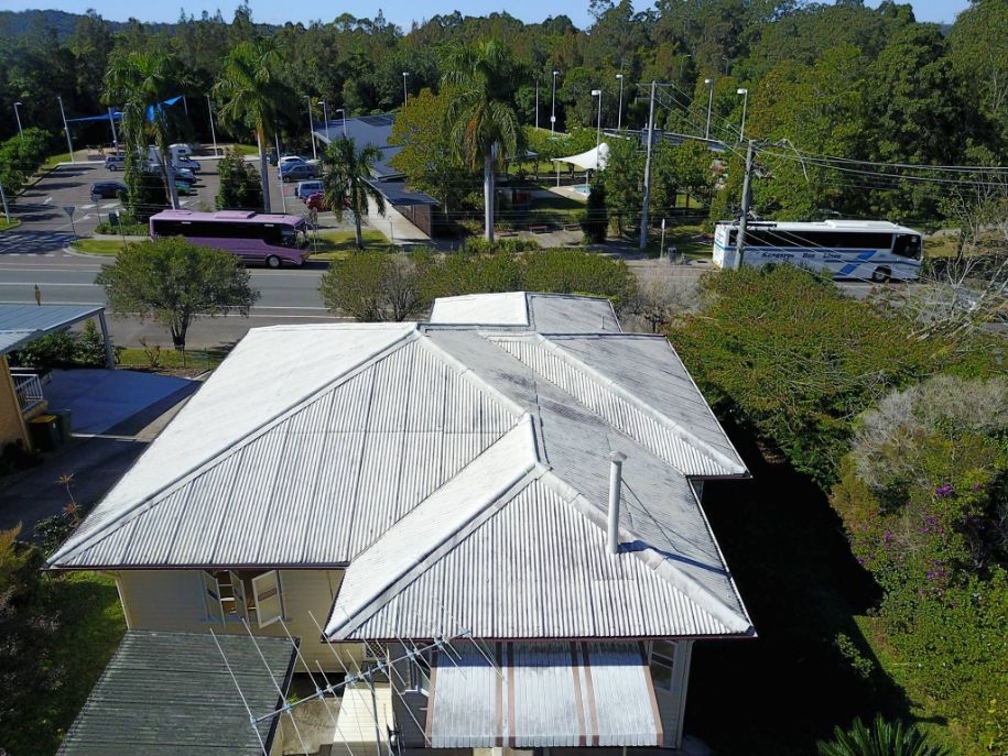 An Aerial View of a House With a White Roof — Stormguard Roofing In Caloundra West, QLD