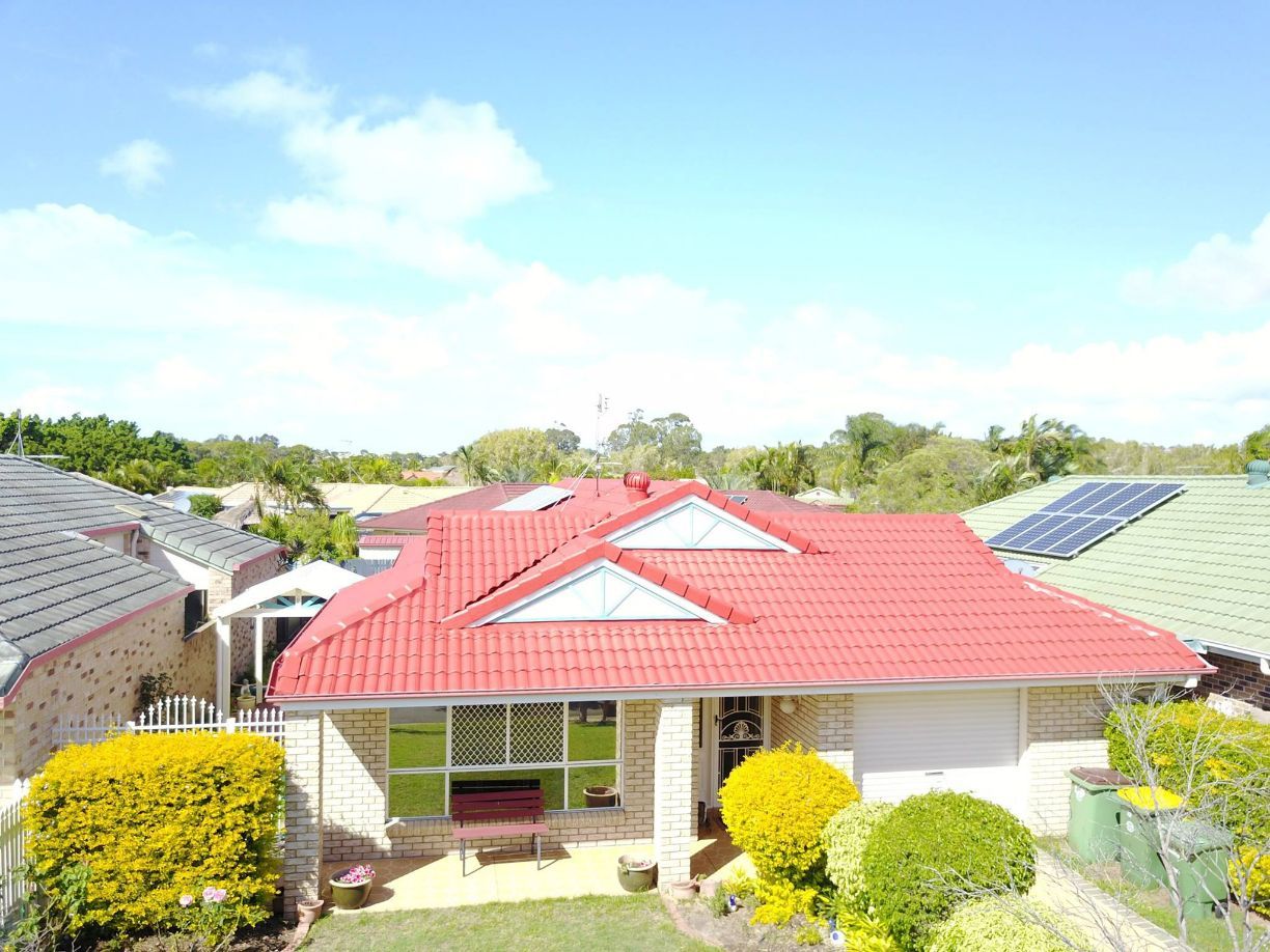 Beautiful House With Red Roof — Roofing in Sunshine Coast, QLD