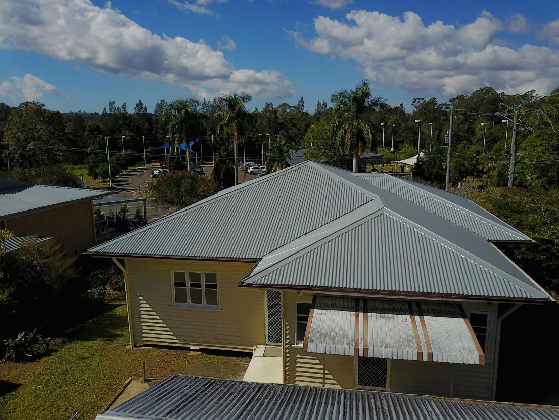 An Aerial View of a House With a Metal Roof — Stormguard Roofing In Caloundra West, QLD